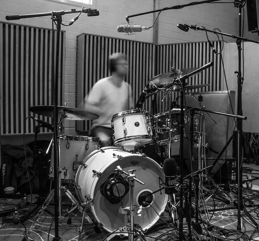 Monochrome photo of Matt Hartnell in a recording studio